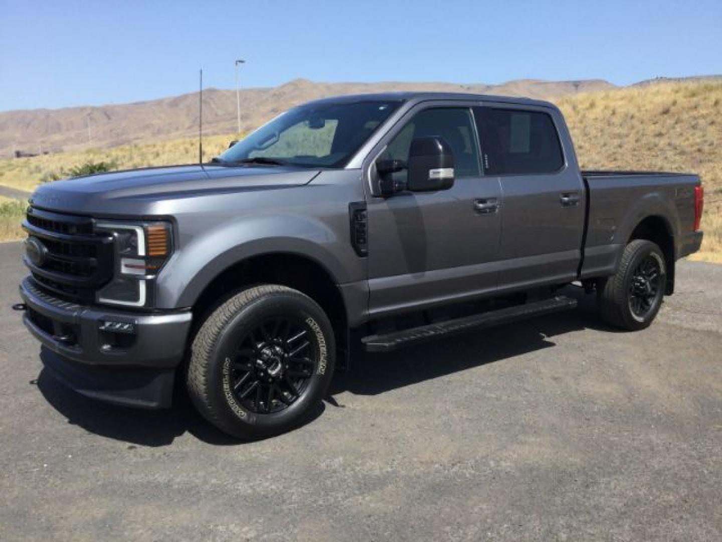 2022 Carbonized Gray Metallic /Black Onyx Ford F-350 Crew Cab 4x4 Lariat (1FT8W3BN6NE) with an 7.3L V-8 variable valve control engine, Automatic, 10-Spd w/SelectShift and TorqShift transmission, located at 1801 Main Street, Lewiston, 83501, (208) 743-9371, 46.417065, -117.004799- Photo#0