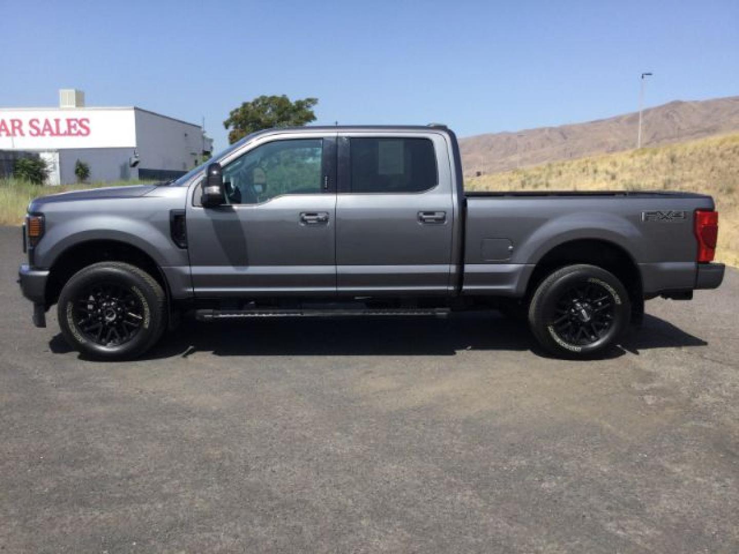 2022 Carbonized Gray Metallic /Black Onyx Ford F-350 Crew Cab 4x4 Lariat (1FT8W3BN6NE) with an 7.3L V-8 variable valve control engine, Automatic, 10-Spd w/SelectShift and TorqShift transmission, located at 1801 Main Street, Lewiston, 83501, (208) 743-9371, 46.417065, -117.004799- Photo#1