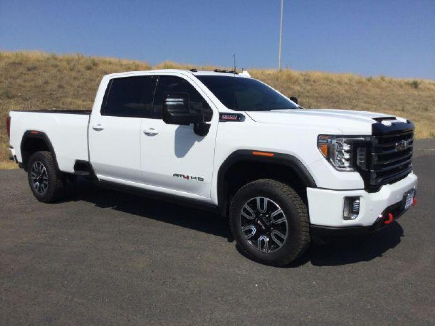 2023 Summit White /Jet Black w/Kalahari Accents GMC Sierra 3500HD 4WD Crew Cab Long Bed AT4 (1GT49VEY1PF) with an Duramax 6.6L V-8 diesel direct injection engine, 10-speed automatic transmission, located at 1801 Main Street, Lewiston, 83501, (208) 743-9371, 46.417065, -117.004799 - Photo#0