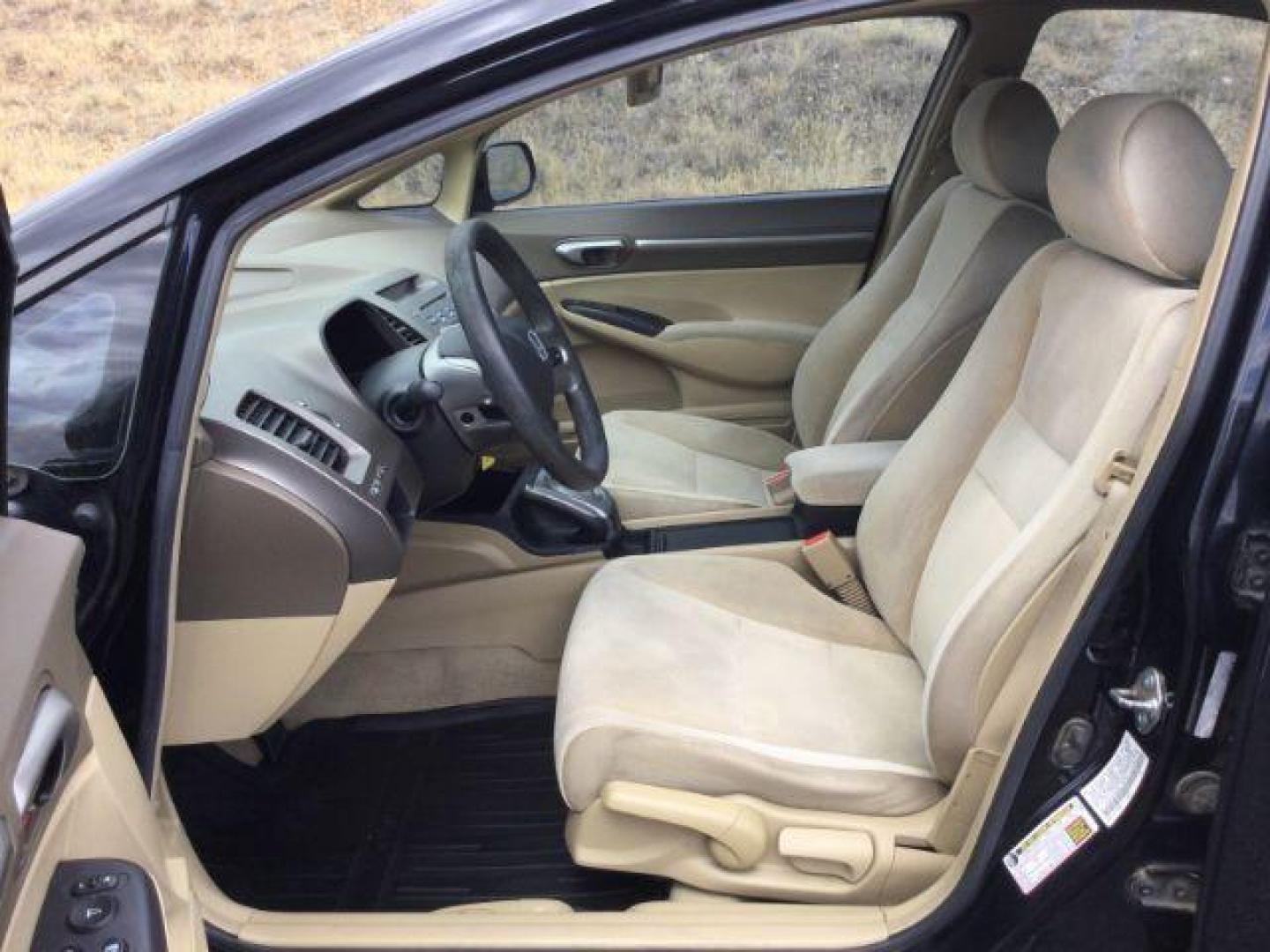 2006 Nighthawk Black Pearl /Ivory Honda Civic EX (1HGFA16886L) with an 1.8L I-4 i-VTEC variable valve control engine, CVT automatic transmission, located at 1801 Main Street, Lewiston, 83501, (208) 743-9371, 46.417065, -117.004799 - Photo#4