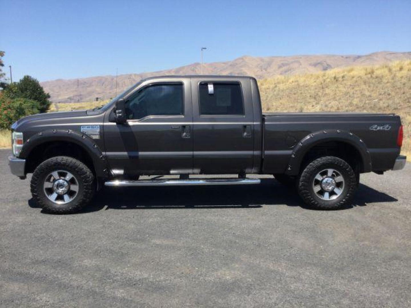 2008 Dark Shadow Gray Clearcoat Metallic Ford F-250 Lariat SuperCrew 6.5ft bed 4WD (1FTSW21R08E) with an 6.4L V8, Turbo Diesel engine, 6-SPEED AUTOMATIC transmission, located at 1801 Main Street, Lewiston, 83501, (208) 743-9371, 46.417065, -117.004799 - Photo#1