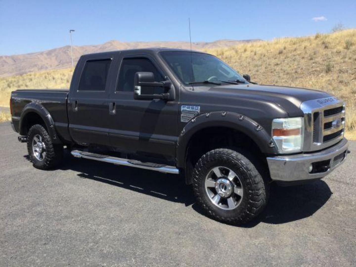 2008 Dark Shadow Gray Clearcoat Metallic Ford F-250 Lariat SuperCrew 6.5ft bed 4WD (1FTSW21R08E) with an 6.4L V8, Turbo Diesel engine, 6-SPEED AUTOMATIC transmission, located at 1801 Main Street, Lewiston, 83501, (208) 743-9371, 46.417065, -117.004799 - Photo#2