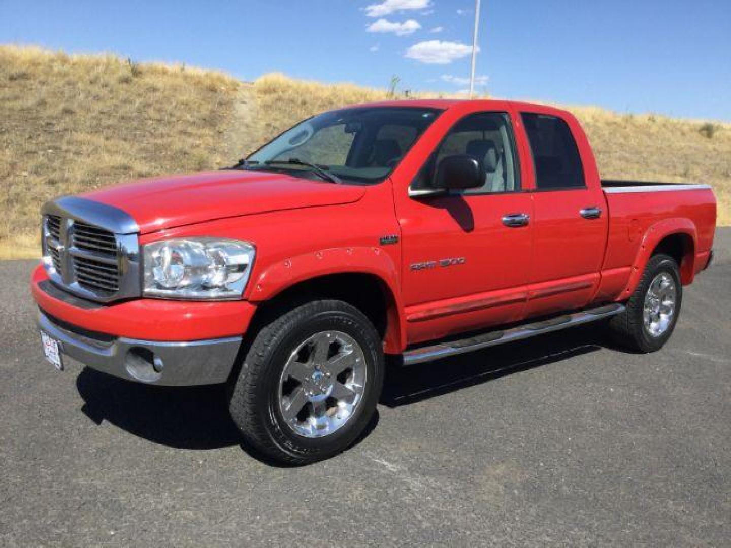 2007 Flame Red Clearcoat /Medium Slate Gray Dodge Ram 1500 Quad Cab SLT 4WD 5.7L V8 (1D7HU18277J) with an 5.7L Hemi V8 engine, 4 speed Automatic transmission, located at 1801 Main Street, Lewiston, 83501, (208) 743-9371, 46.417065, -117.004799 - Photo#0