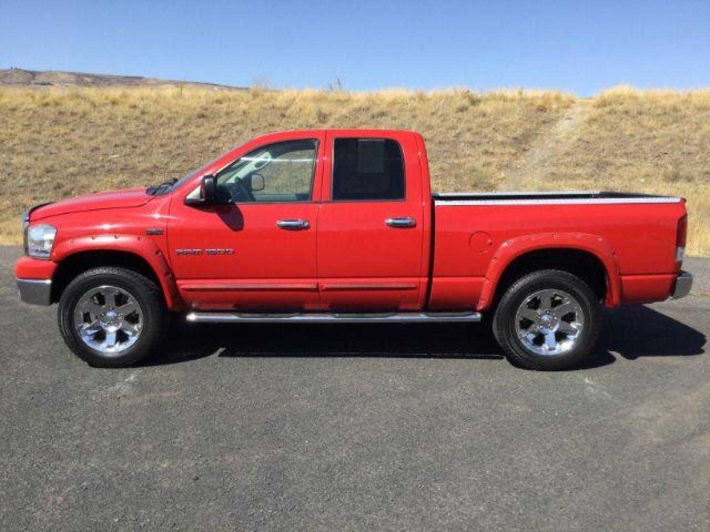 2007 Flame Red Clearcoat /Medium Slate Gray Dodge Ram 1500 Quad Cab SLT 4WD 5.7L V8 (1D7HU18277J) with an 5.7L Hemi V8 engine, 4 speed Automatic transmission, located at 1801 Main Street, Lewiston, 83501, (208) 743-9371, 46.417065, -117.004799 - Photo#1