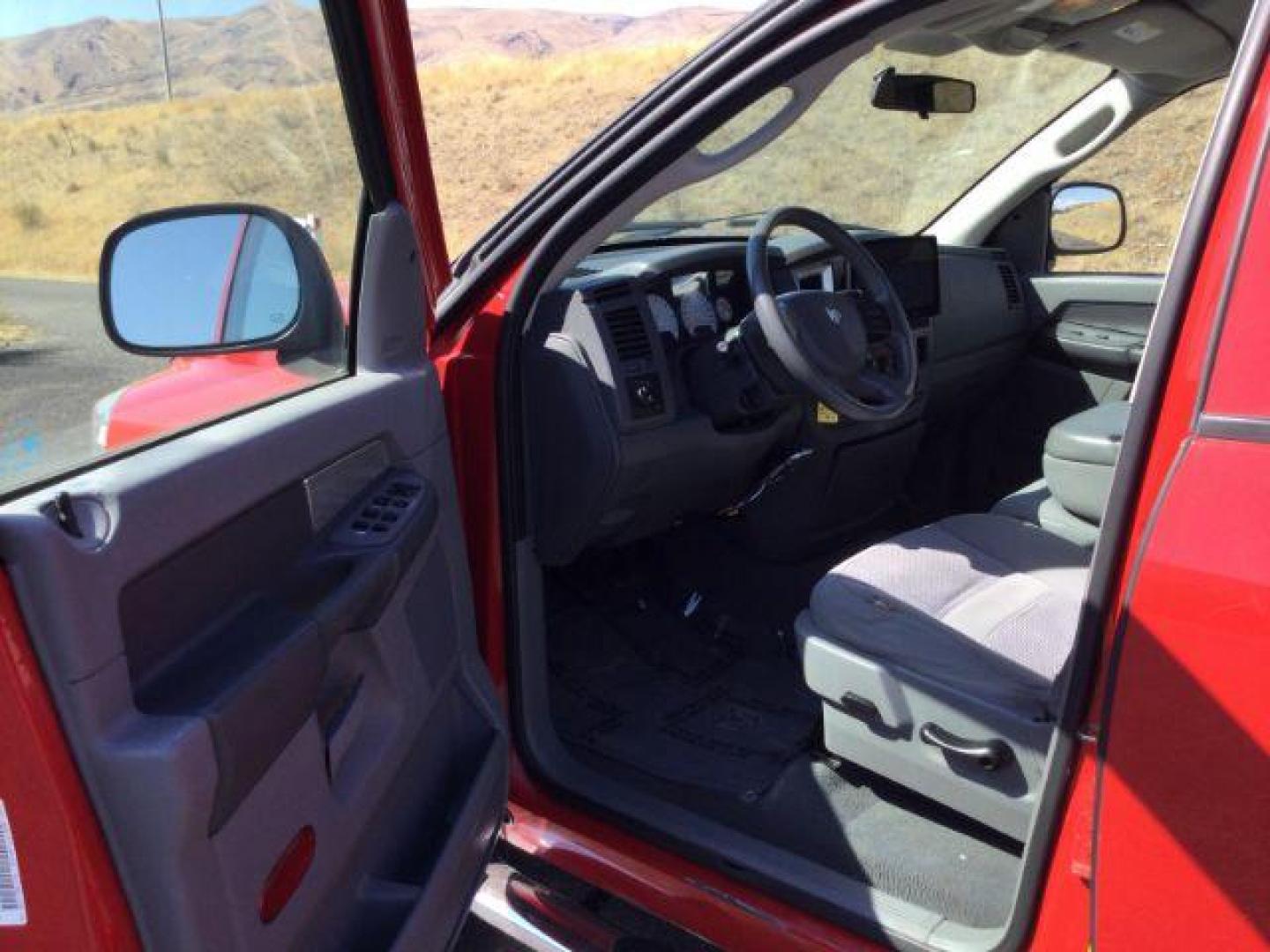 2007 Flame Red Clearcoat /Medium Slate Gray Dodge Ram 1500 Quad Cab SLT 4WD 5.7L V8 (1D7HU18277J) with an 5.7L Hemi V8 engine, 4 speed Automatic transmission, located at 1801 Main Street, Lewiston, 83501, (208) 743-9371, 46.417065, -117.004799 - Photo#2