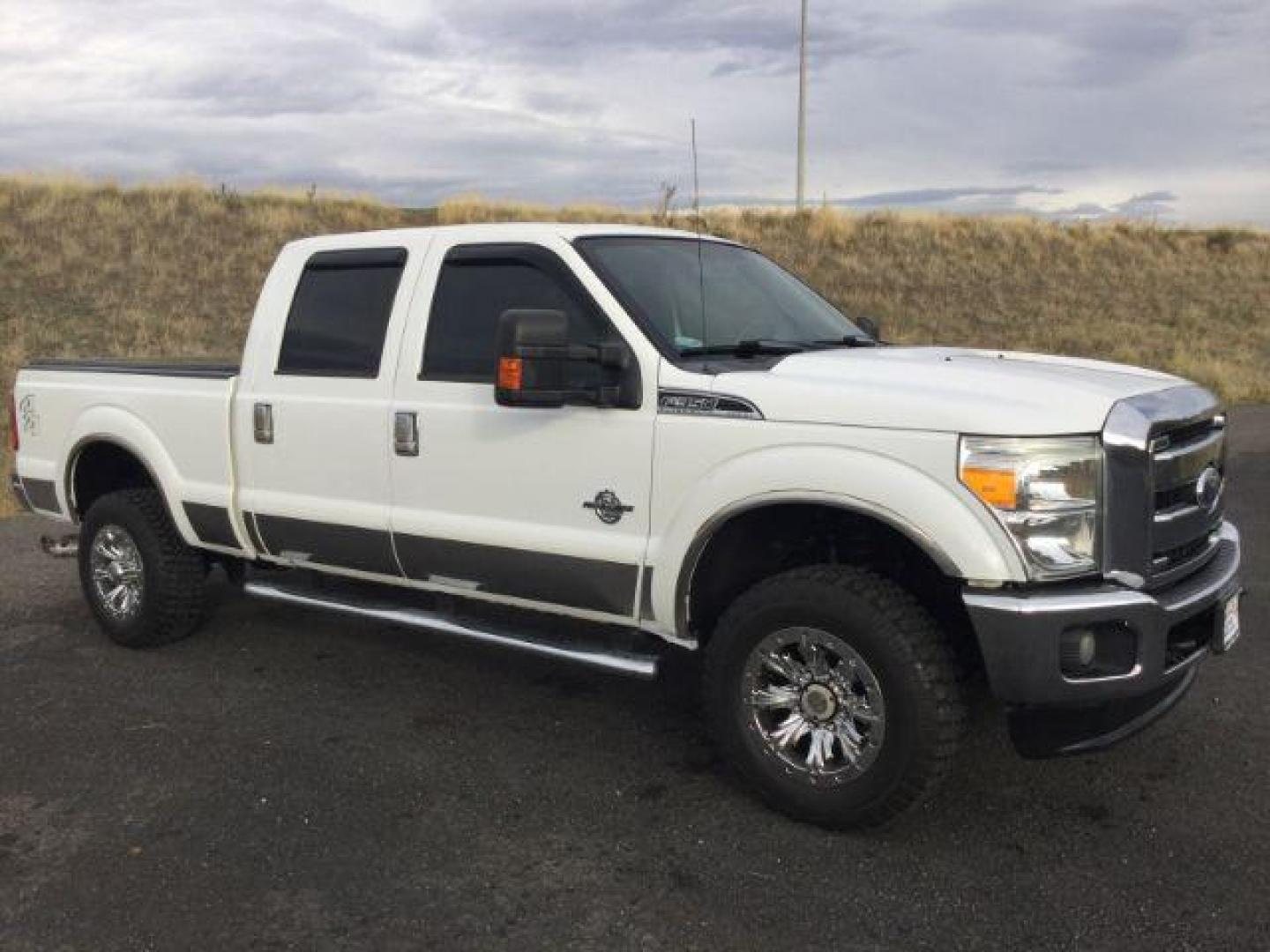2011 Oxford White /Black Ford F-350 LARIAT (1FT8W3BTXBE) with an Powerstroke 6.7L V-8 diesel direct injection engine, 6-SPEED AUTOMATIC transmission, located at 1801 Main Street, Lewiston, 83501, (208) 743-9371, 46.417065, -117.004799 - Photo#0