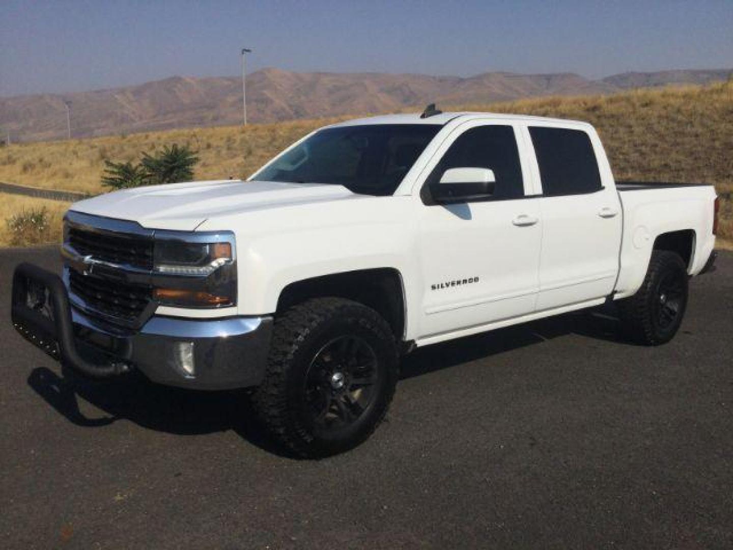 2017 Summit White Chevrolet Silverado 1500 1LT (3GCUKREC7HG) with an EcoTec3 4.3L V-6 gasoline direct injection engine, located at 1801 Main Street, Lewiston, 83501, (208) 743-9371, 46.417065, -117.004799 - Photo#0