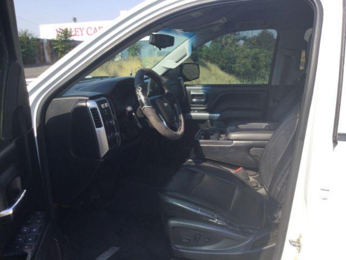 2017 Summit White Chevrolet Silverado 1500 1LT (3GCUKREC7HG) with an EcoTec3 4.3L V-6 gasoline direct injection engine, located at 1801 Main Street, Lewiston, 83501, (208) 743-9371, 46.417065, -117.004799 - Photo#3