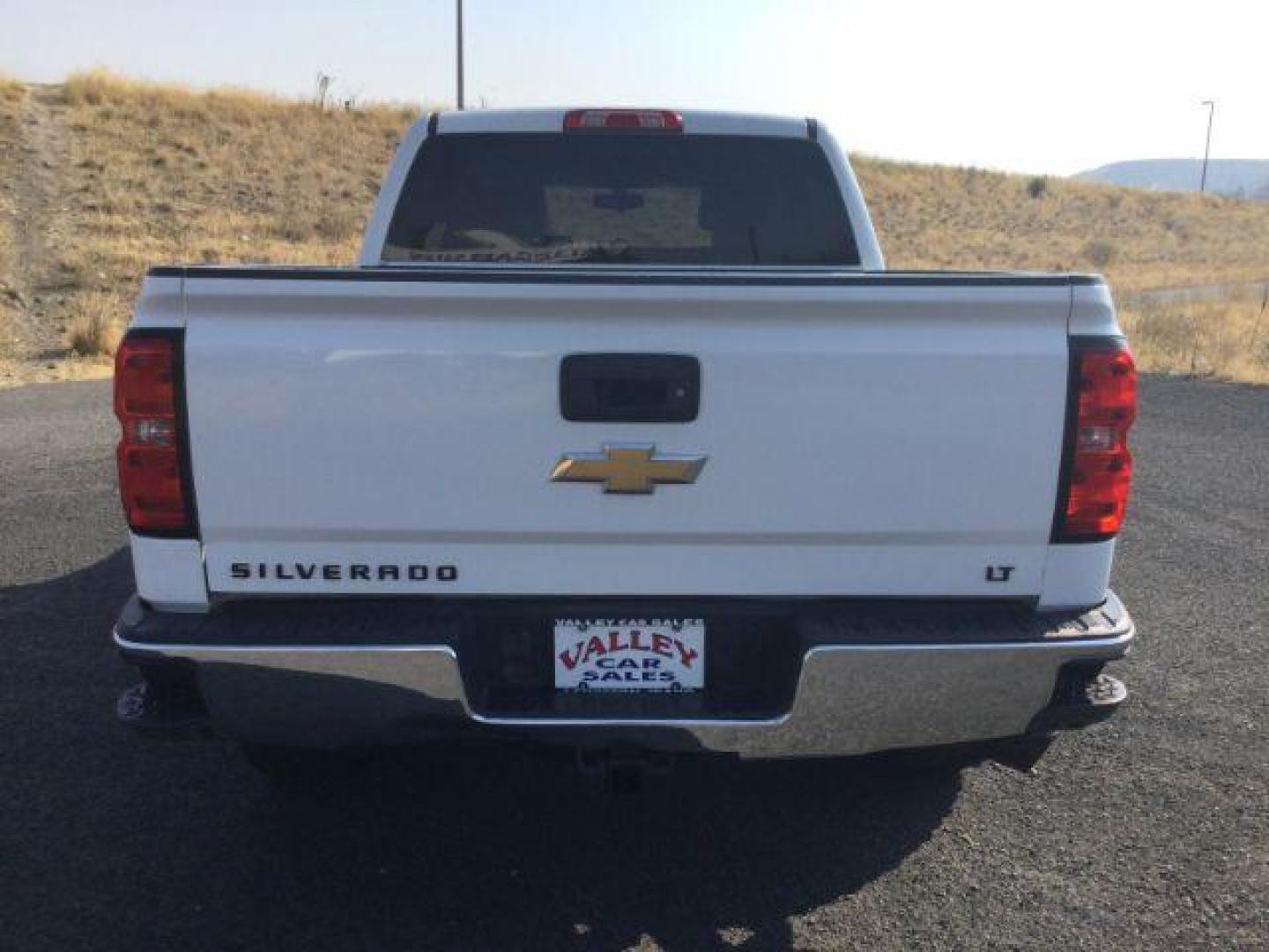 2017 Summit White Chevrolet Silverado 1500 1LT (3GCUKREC7HG) with an EcoTec3 4.3L V-6 gasoline direct injection engine, located at 1801 Main Street, Lewiston, 83501, (208) 743-9371, 46.417065, -117.004799 - Photo#11