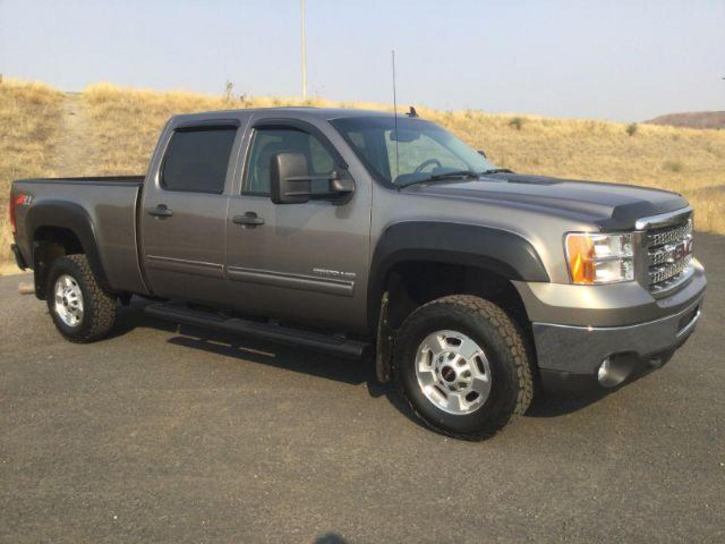 2012 Mocha Steel Metallic /Ebony GMC Sierra 2500HD SLE (1GT120C85CF) with an Duramax 6.6L V-8 diesel direct injection engine, 6-Speed Automatic transmission, located at 1801 Main Street, Lewiston, 83501, (208) 743-9371, 46.417065, -117.004799 - Photo#7
