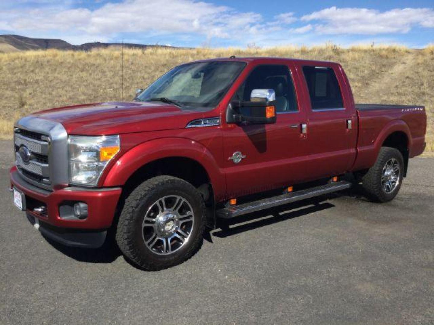 2015 Ruby Red Metallic Tinted Clearcoat /BLACK LEATHER Ford F-350 Lariat Crew Cab 4WD (1FT8W3BT5FE) with an Powerstroke 6.7L V-8 diesel direct injection engine, 6-Speed Automatic transmission, located at 1801 Main Street, Lewiston, 83501, (208) 743-9371, 46.417065, -117.004799 - Photo#0