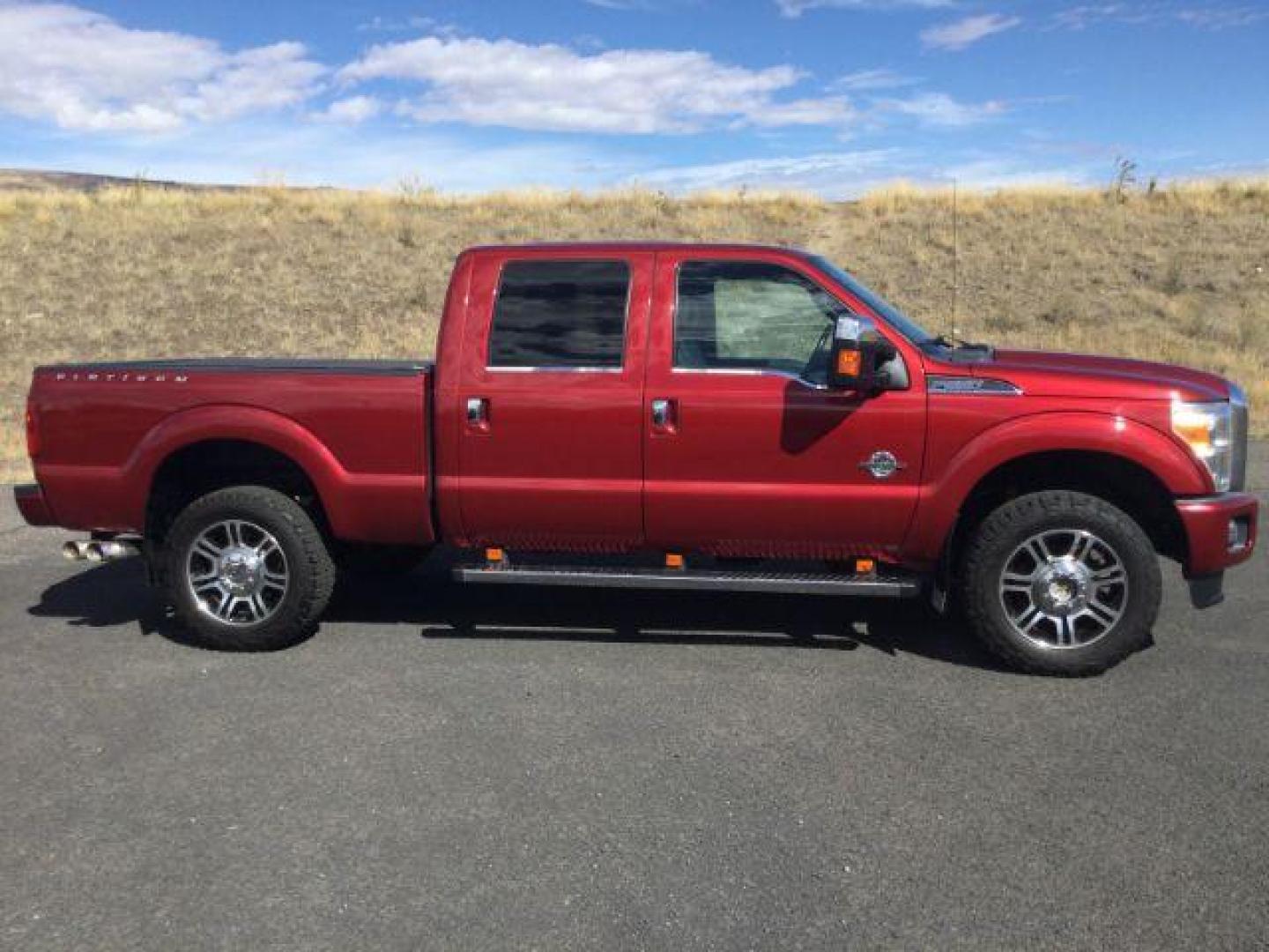 2015 Ruby Red Metallic Tinted Clearcoat /BLACK LEATHER Ford F-350 Lariat Crew Cab 4WD (1FT8W3BT5FE) with an Powerstroke 6.7L V-8 diesel direct injection engine, 6-Speed Automatic transmission, located at 1801 Main Street, Lewiston, 83501, (208) 743-9371, 46.417065, -117.004799 - Photo#1