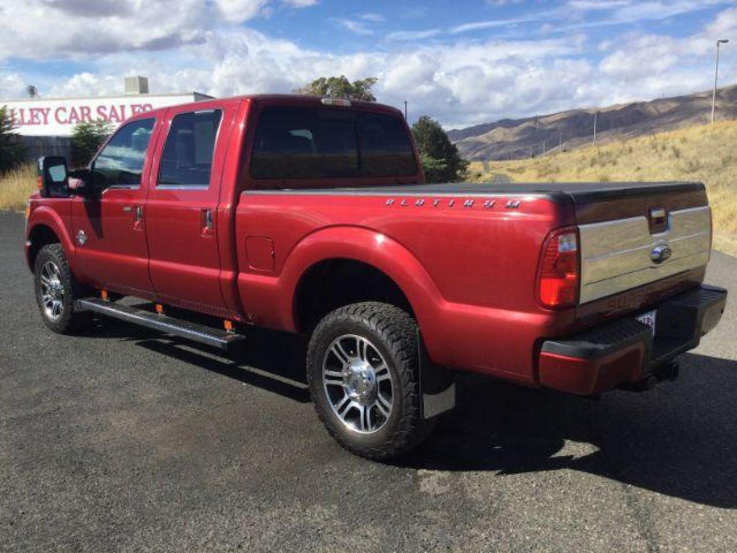 2015 Ruby Red Metallic Tinted Clearcoat /BLACK LEATHER Ford F-350 Lariat Crew Cab 4WD (1FT8W3BT5FE) with an Powerstroke 6.7L V-8 diesel direct injection engine, 6-Speed Automatic transmission, located at 1801 Main Street, Lewiston, 83501, (208) 743-9371, 46.417065, -117.004799 - Photo#4