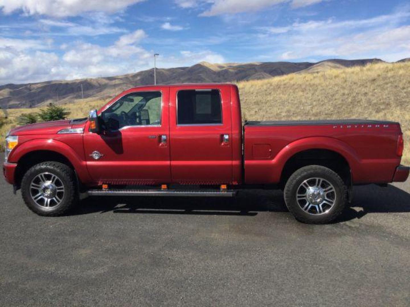 2015 Ruby Red Metallic Tinted Clearcoat /BLACK LEATHER Ford F-350 Lariat Crew Cab 4WD (1FT8W3BT5FE) with an Powerstroke 6.7L V-8 diesel direct injection engine, 6-Speed Automatic transmission, located at 1801 Main Street, Lewiston, 83501, (208) 743-9371, 46.417065, -117.004799 - Photo#5