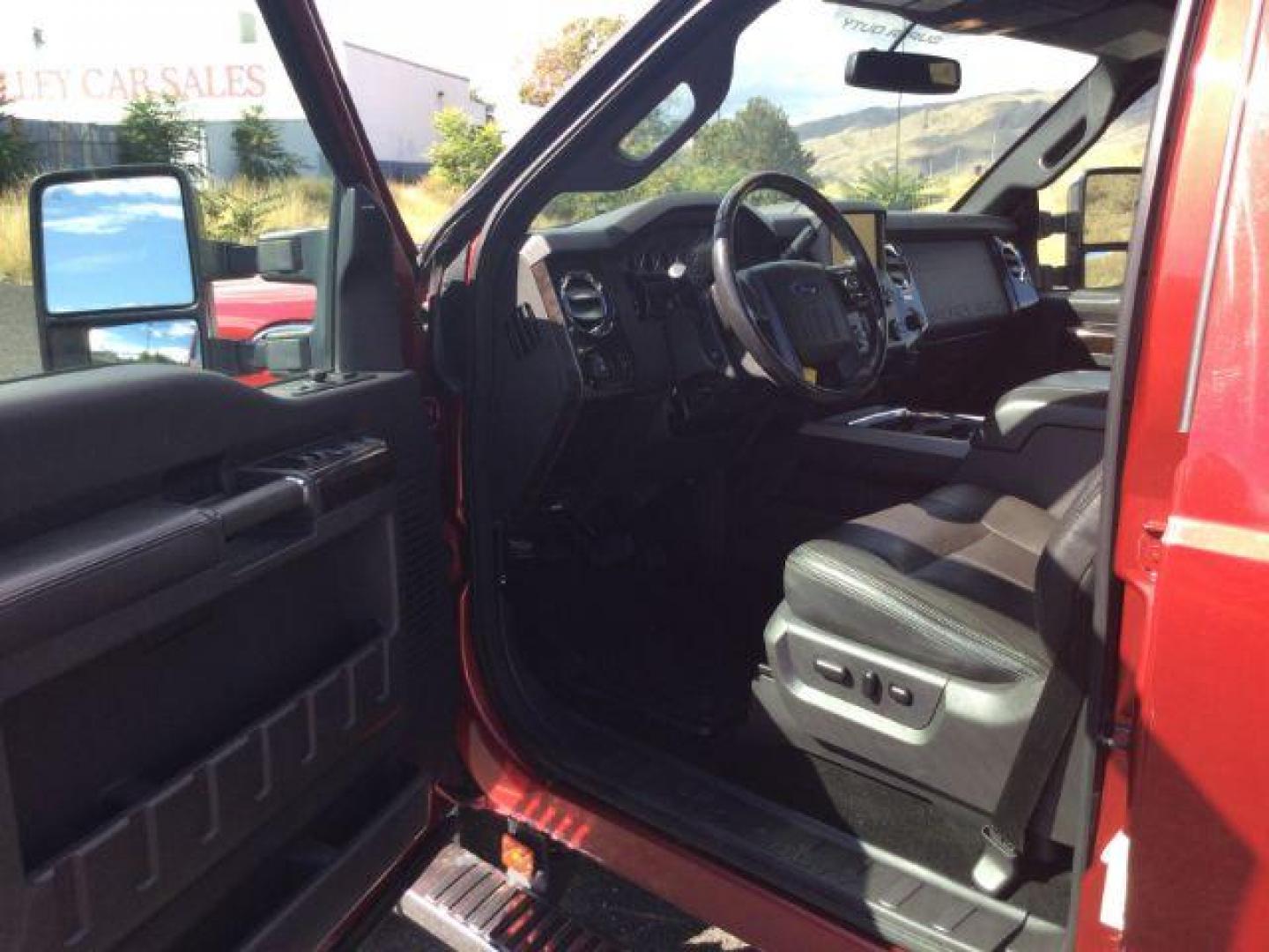 2015 Ruby Red Metallic Tinted Clearcoat /BLACK LEATHER Ford F-350 Lariat Crew Cab 4WD (1FT8W3BT5FE) with an Powerstroke 6.7L V-8 diesel direct injection engine, 6-Speed Automatic transmission, located at 1801 Main Street, Lewiston, 83501, (208) 743-9371, 46.417065, -117.004799 - Photo#18