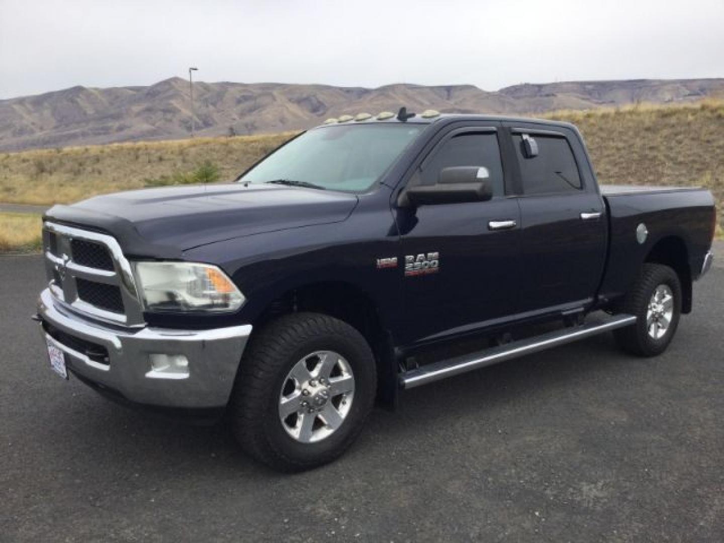 2014 True Blue Pearlcoat /Diesel Gray/Black Ram 2500 Crew Cab 4x4 SLT (3C6UR5DJ7EG) with an HEMI 6.4L V-8 VVT variable valve control engine, 6-Speed Automatic transmission, located at 1801 Main Street, Lewiston, 83501, (208) 743-9371, 46.417065, -117.004799- Photo#0