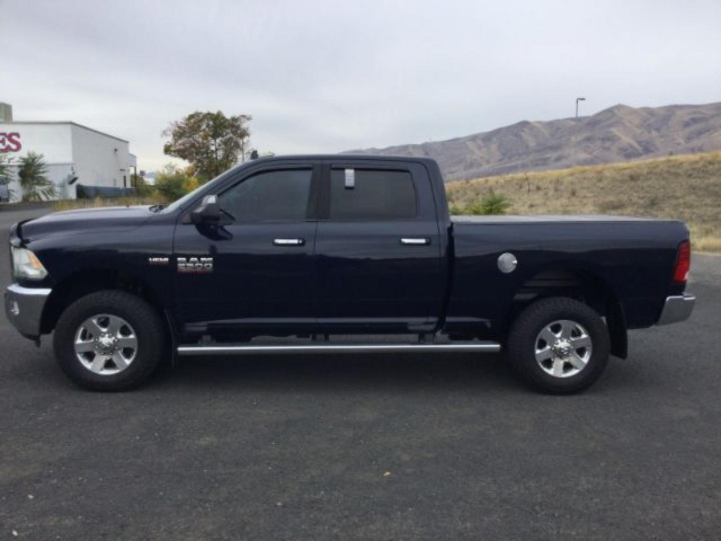 2014 True Blue Pearlcoat /Diesel Gray/Black Ram 2500 Crew Cab 4x4 SLT (3C6UR5DJ7EG) with an HEMI 6.4L V-8 VVT variable valve control engine, 6-Speed Automatic transmission, located at 1801 Main Street, Lewiston, 83501, (208) 743-9371, 46.417065, -117.004799- Photo#1