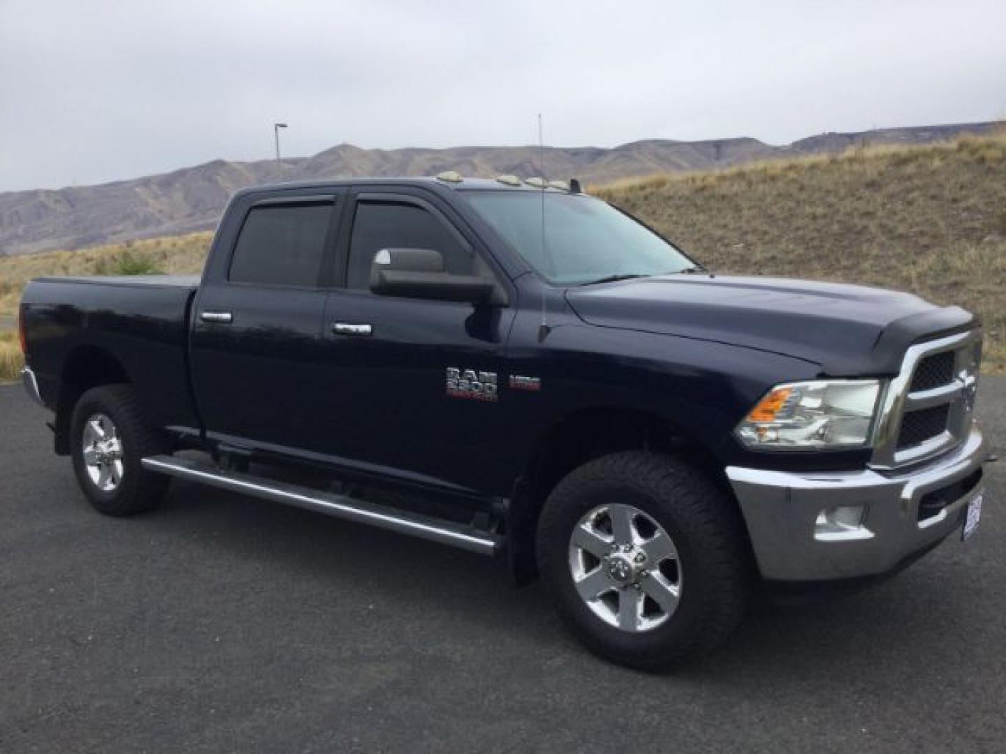2014 True Blue Pearlcoat /Diesel Gray/Black Ram 2500 Crew Cab 4x4 SLT (3C6UR5DJ7EG) with an HEMI 6.4L V-8 VVT variable valve control engine, 6-Speed Automatic transmission, located at 1801 Main Street, Lewiston, 83501, (208) 743-9371, 46.417065, -117.004799- Photo#2