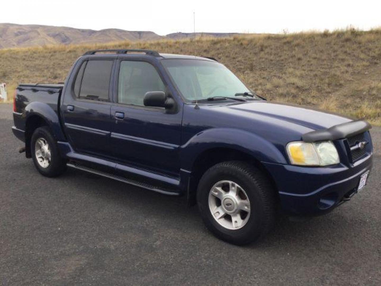 2004 Dark Blue Pearl Clearcoat Metallic /Medium Dark Flint/Dark Flint Ford Explorer Sport Trac XLT (1FMZU77K74U) with an 4.0L V6 DOHC 24V engine, 4 speed Automatic transmission, located at 1801 Main Street, Lewiston, 83501, (208) 743-9371, 46.417065, -117.004799 - Photo#0