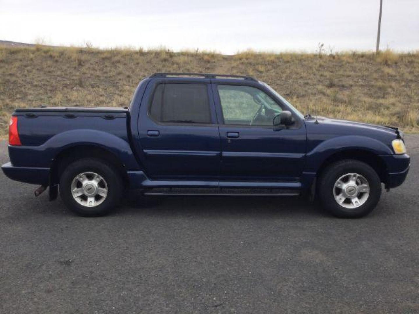 2004 Dark Blue Pearl Clearcoat Metallic /Medium Dark Flint/Dark Flint Ford Explorer Sport Trac XLT (1FMZU77K74U) with an 4.0L V6 DOHC 24V engine, 4 speed Automatic transmission, located at 1801 Main Street, Lewiston, 83501, (208) 743-9371, 46.417065, -117.004799 - Photo#2