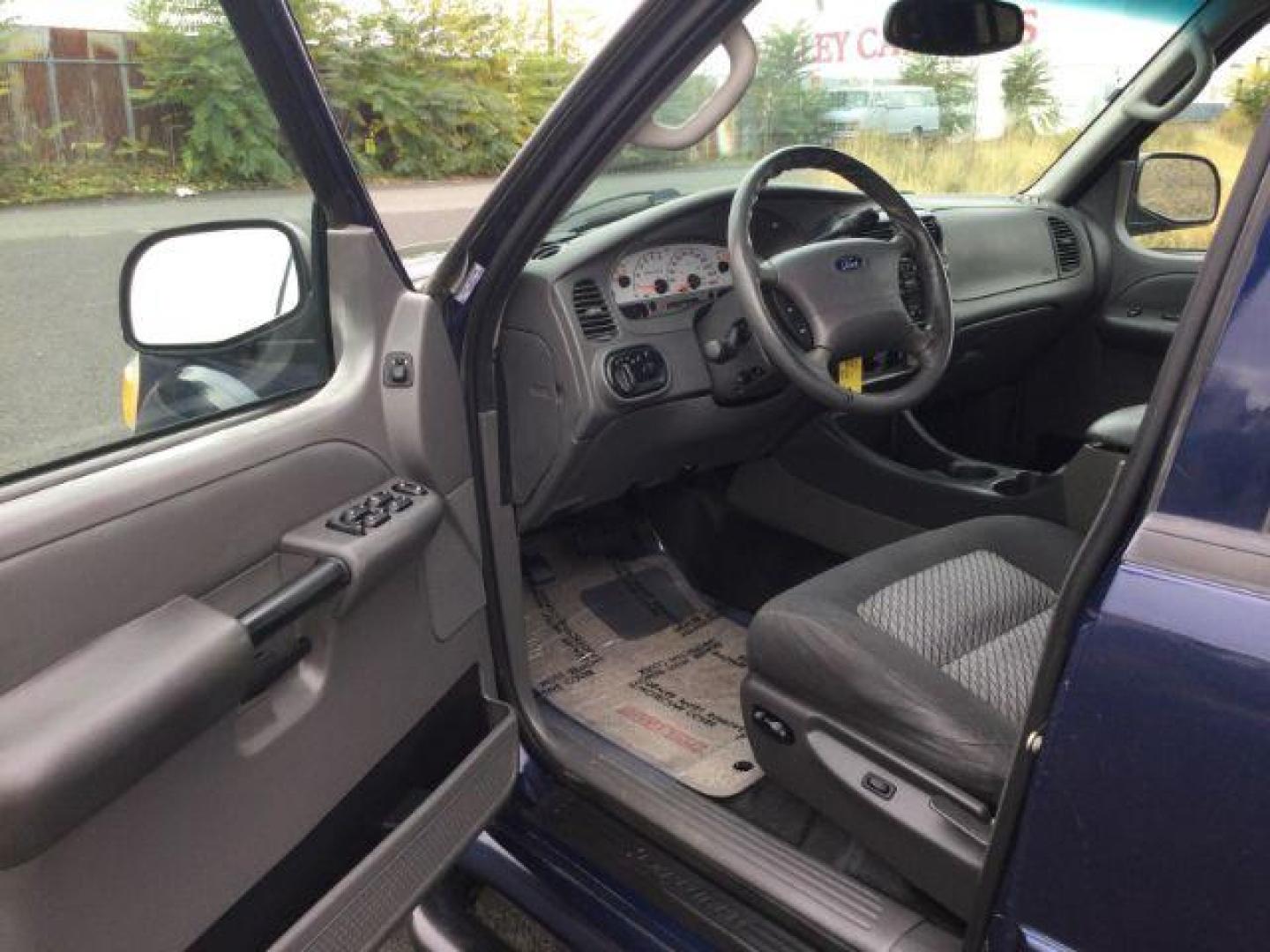 2004 Dark Blue Pearl Clearcoat Metallic /Medium Dark Flint/Dark Flint Ford Explorer Sport Trac XLT (1FMZU77K74U) with an 4.0L V6 DOHC 24V engine, 4 speed Automatic transmission, located at 1801 Main Street, Lewiston, 83501, (208) 743-9371, 46.417065, -117.004799 - Photo#3