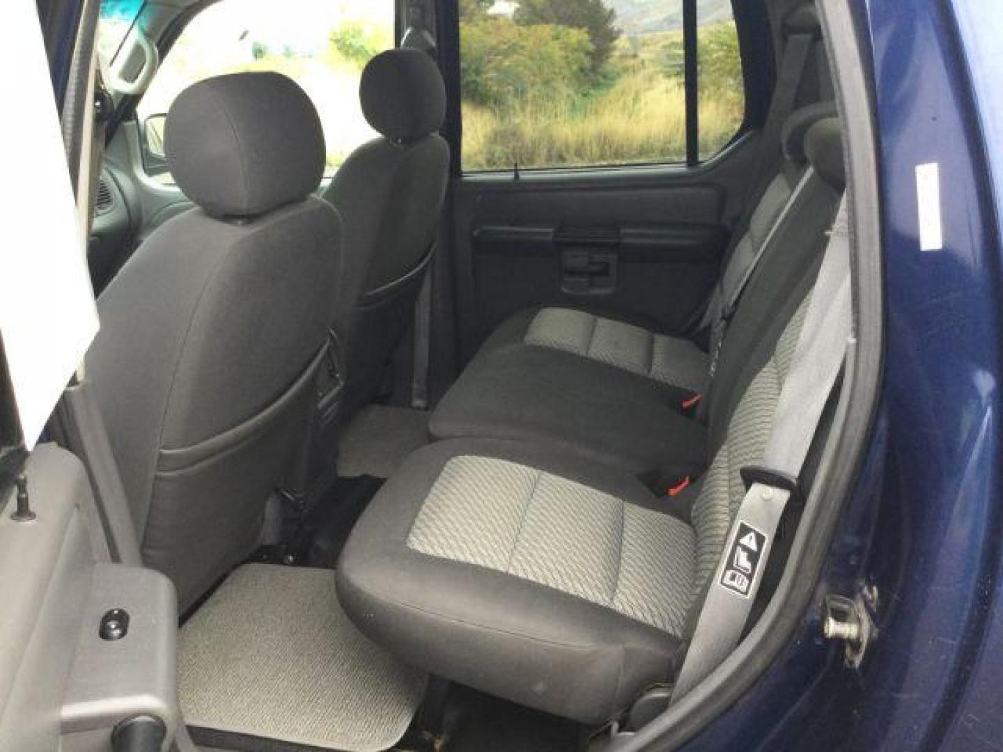 2004 Dark Blue Pearl Clearcoat Metallic /Medium Dark Flint/Dark Flint Ford Explorer Sport Trac XLT (1FMZU77K74U) with an 4.0L V6 DOHC 24V engine, 4 speed Automatic transmission, located at 1801 Main Street, Lewiston, 83501, (208) 743-9371, 46.417065, -117.004799 - Photo#4