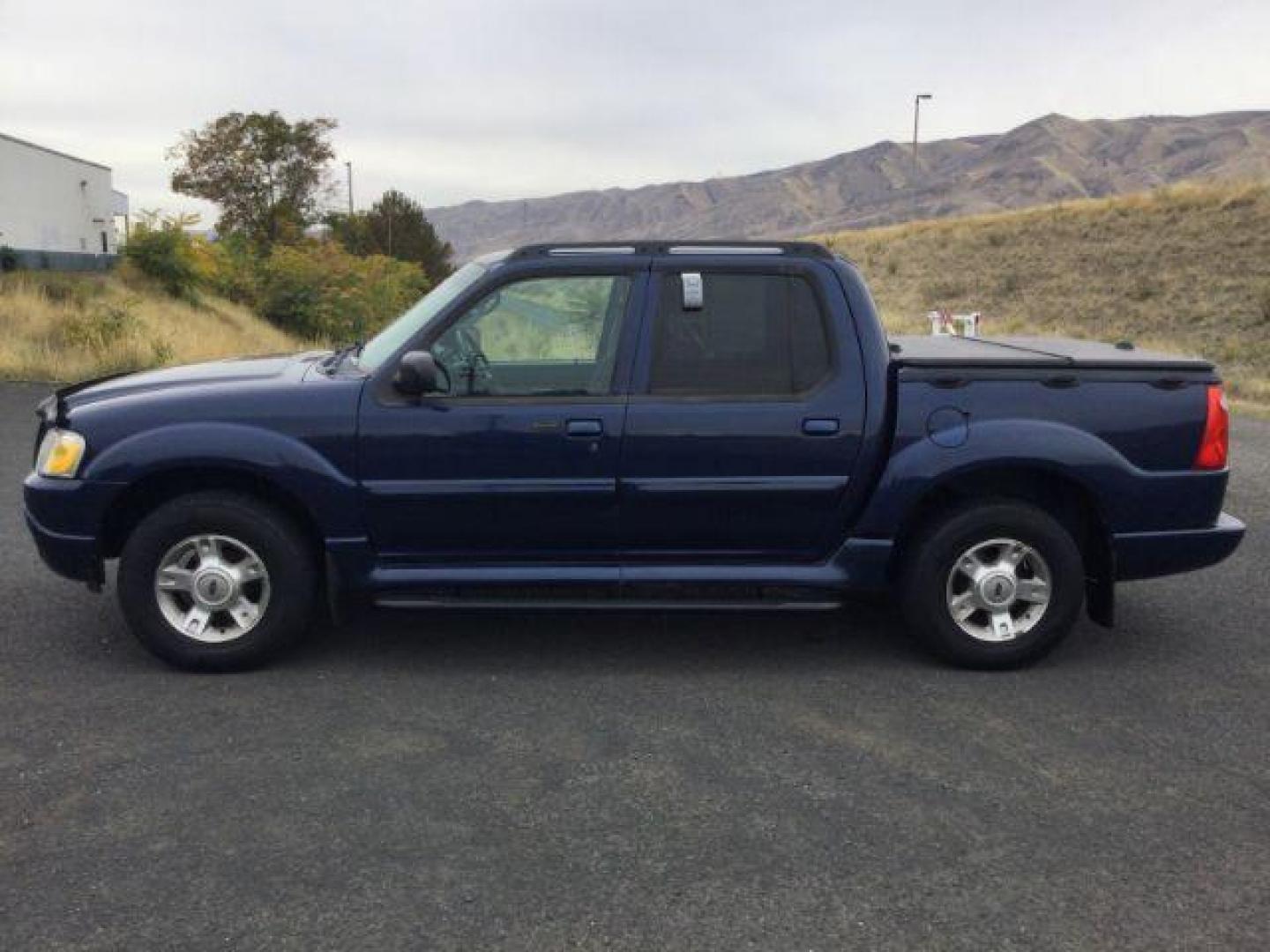 2004 Dark Blue Pearl Clearcoat Metallic /Medium Dark Flint/Dark Flint Ford Explorer Sport Trac XLT (1FMZU77K74U) with an 4.0L V6 DOHC 24V engine, 4 speed Automatic transmission, located at 1801 Main Street, Lewiston, 83501, (208) 743-9371, 46.417065, -117.004799 - Photo#6