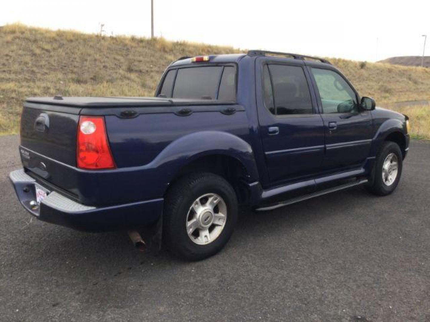 2004 Dark Blue Pearl Clearcoat Metallic /Medium Dark Flint/Dark Flint Ford Explorer Sport Trac XLT (1FMZU77K74U) with an 4.0L V6 DOHC 24V engine, 4 speed Automatic transmission, located at 1801 Main Street, Lewiston, 83501, (208) 743-9371, 46.417065, -117.004799 - Photo#7