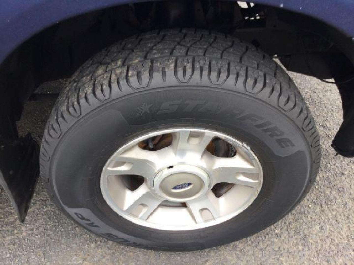 2004 Dark Blue Pearl Clearcoat Metallic /Medium Dark Flint/Dark Flint Ford Explorer Sport Trac XLT (1FMZU77K74U) with an 4.0L V6 DOHC 24V engine, 4 speed Automatic transmission, located at 1801 Main Street, Lewiston, 83501, (208) 743-9371, 46.417065, -117.004799 - Photo#12