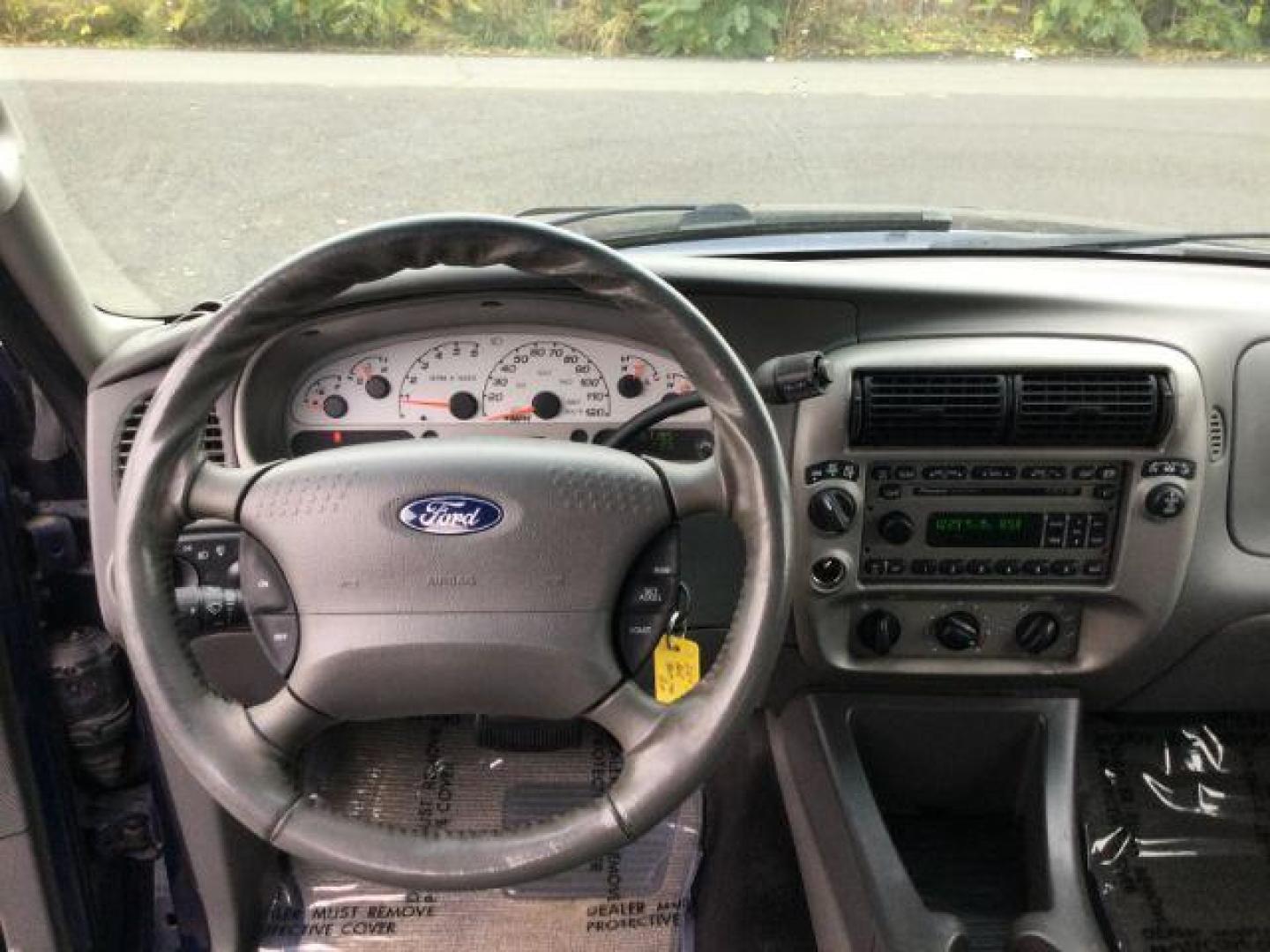2004 Dark Blue Pearl Clearcoat Metallic /Medium Dark Flint/Dark Flint Ford Explorer Sport Trac XLT (1FMZU77K74U) with an 4.0L V6 DOHC 24V engine, 4 speed Automatic transmission, located at 1801 Main Street, Lewiston, 83501, (208) 743-9371, 46.417065, -117.004799 - Photo#15