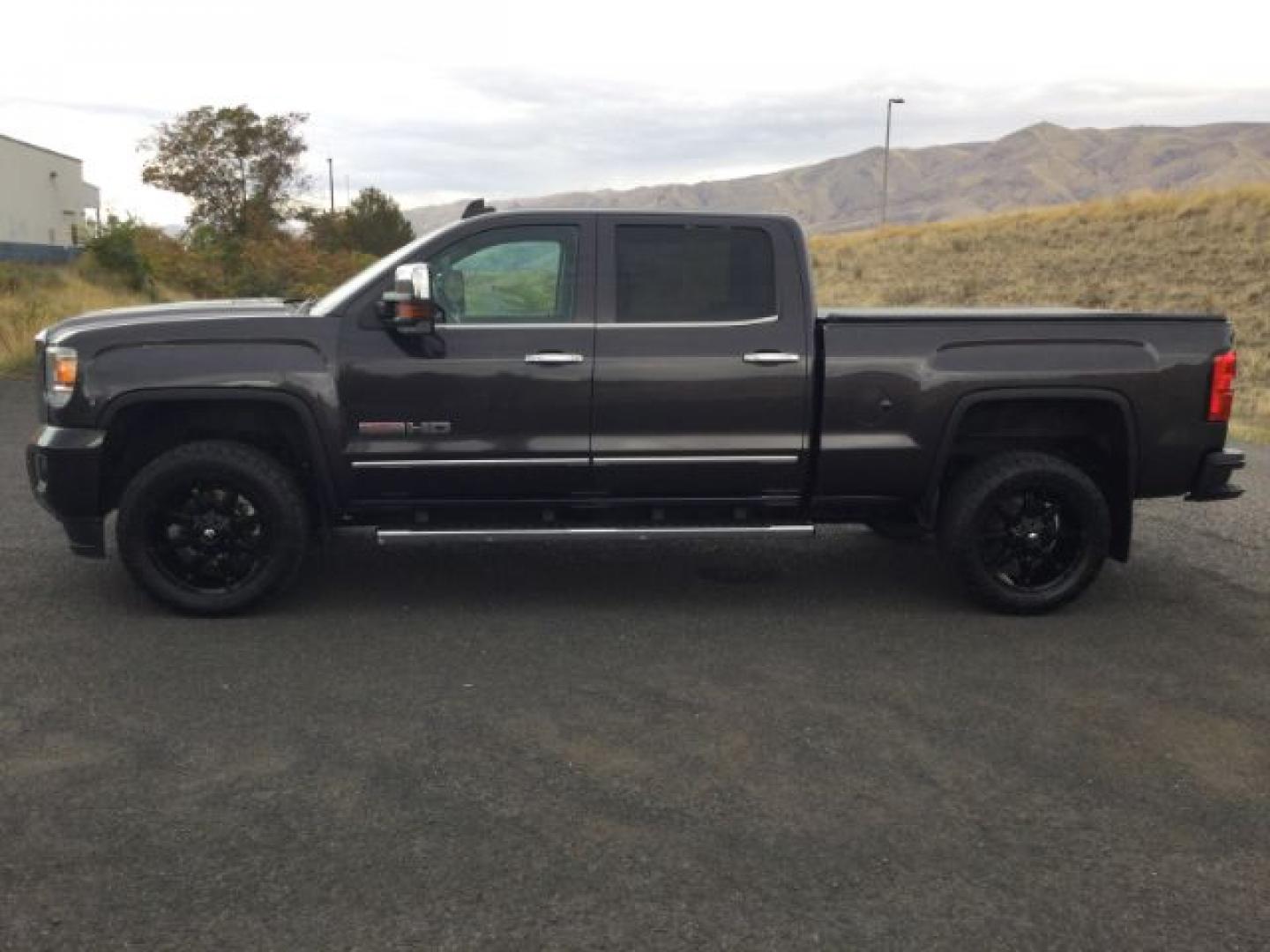 2015 Iridium Metallic /Dark Ash/Jet Black GMC 3500 Crew 4x4 SLT (1GT423C85FF) with an 6.6L V8 OHV 32V TURBO DIESEL engine, 6-Speed Automatic transmission, located at 1801 Main Street, Lewiston, 83501, (208) 743-9371, 46.417065, -117.004799- Photo#2