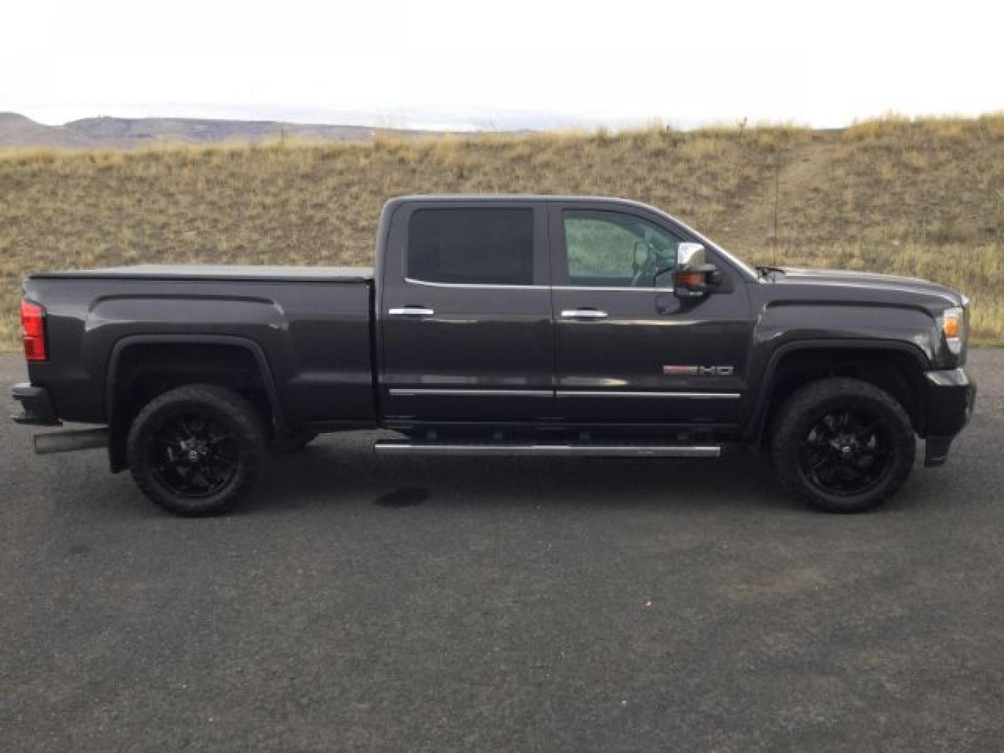 2015 Iridium Metallic /Dark Ash/Jet Black GMC 3500 Crew 4x4 SLT (1GT423C85FF) with an 6.6L V8 OHV 32V TURBO DIESEL engine, 6-Speed Automatic transmission, located at 1801 Main Street, Lewiston, 83501, (208) 743-9371, 46.417065, -117.004799- Photo#3