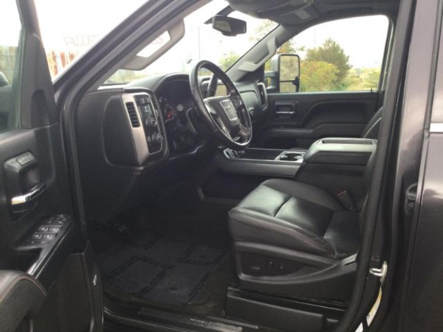2015 Iridium Metallic /Dark Ash/Jet Black GMC 3500 Crew 4x4 SLT (1GT423C85FF) with an 6.6L V8 OHV 32V TURBO DIESEL engine, 6-Speed Automatic transmission, located at 1801 Main Street, Lewiston, 83501, (208) 743-9371, 46.417065, -117.004799- Photo#4