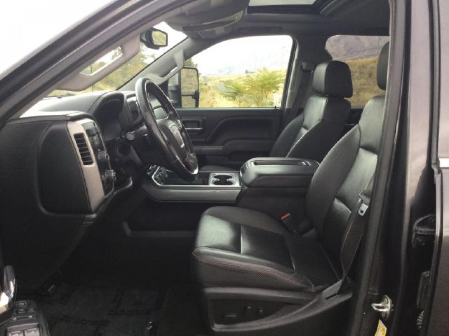2015 Iridium Metallic /Dark Ash/Jet Black GMC 3500 Crew 4x4 SLT (1GT423C85FF) with an 6.6L V8 OHV 32V TURBO DIESEL engine, 6-Speed Automatic transmission, located at 1801 Main Street, Lewiston, 83501, (208) 743-9371, 46.417065, -117.004799- Photo#6