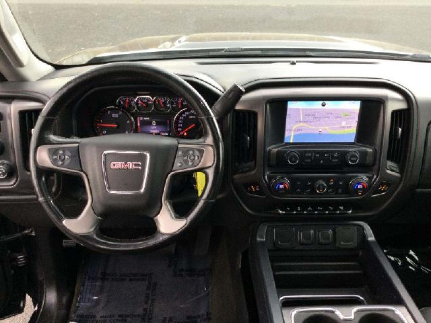 2015 Iridium Metallic /Dark Ash/Jet Black GMC 3500 Crew 4x4 SLT (1GT423C85FF) with an 6.6L V8 OHV 32V TURBO DIESEL engine, 6-Speed Automatic transmission, located at 1801 Main Street, Lewiston, 83501, (208) 743-9371, 46.417065, -117.004799- Photo#7