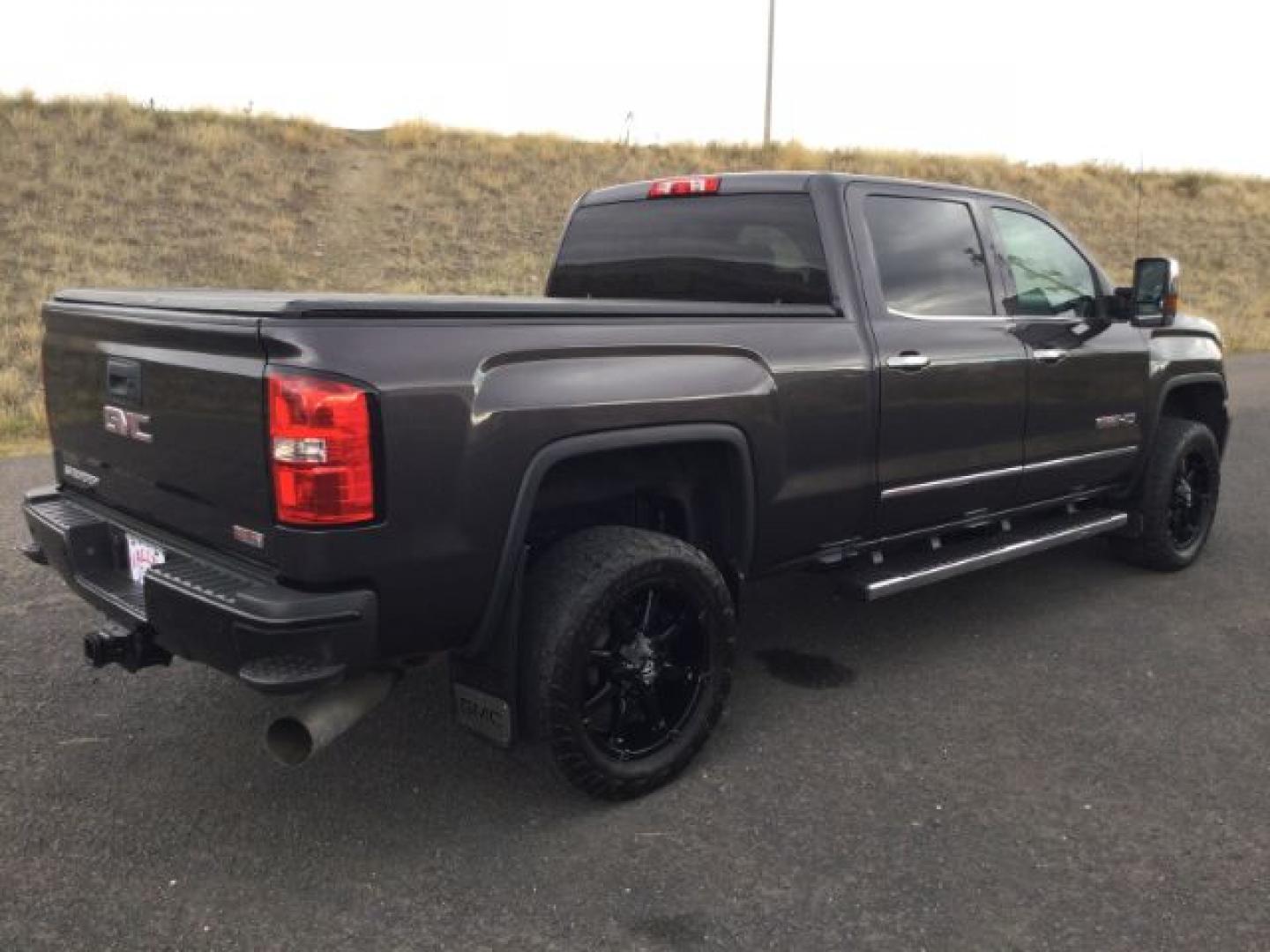 2015 Iridium Metallic /Dark Ash/Jet Black GMC 3500 Crew 4x4 SLT (1GT423C85FF) with an 6.6L V8 OHV 32V TURBO DIESEL engine, 6-Speed Automatic transmission, located at 1801 Main Street, Lewiston, 83501, (208) 743-9371, 46.417065, -117.004799- Photo#8