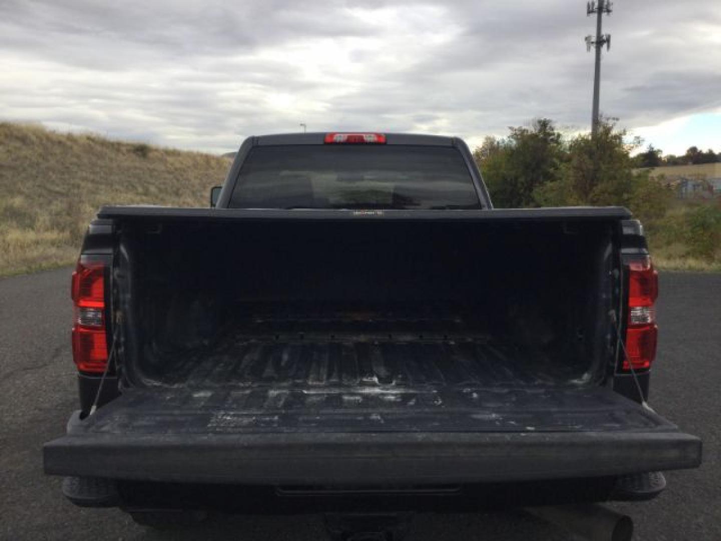 2015 Iridium Metallic /Dark Ash/Jet Black GMC 3500 Crew 4x4 SLT (1GT423C85FF) with an 6.6L V8 OHV 32V TURBO DIESEL engine, 6-Speed Automatic transmission, located at 1801 Main Street, Lewiston, 83501, (208) 743-9371, 46.417065, -117.004799- Photo#9