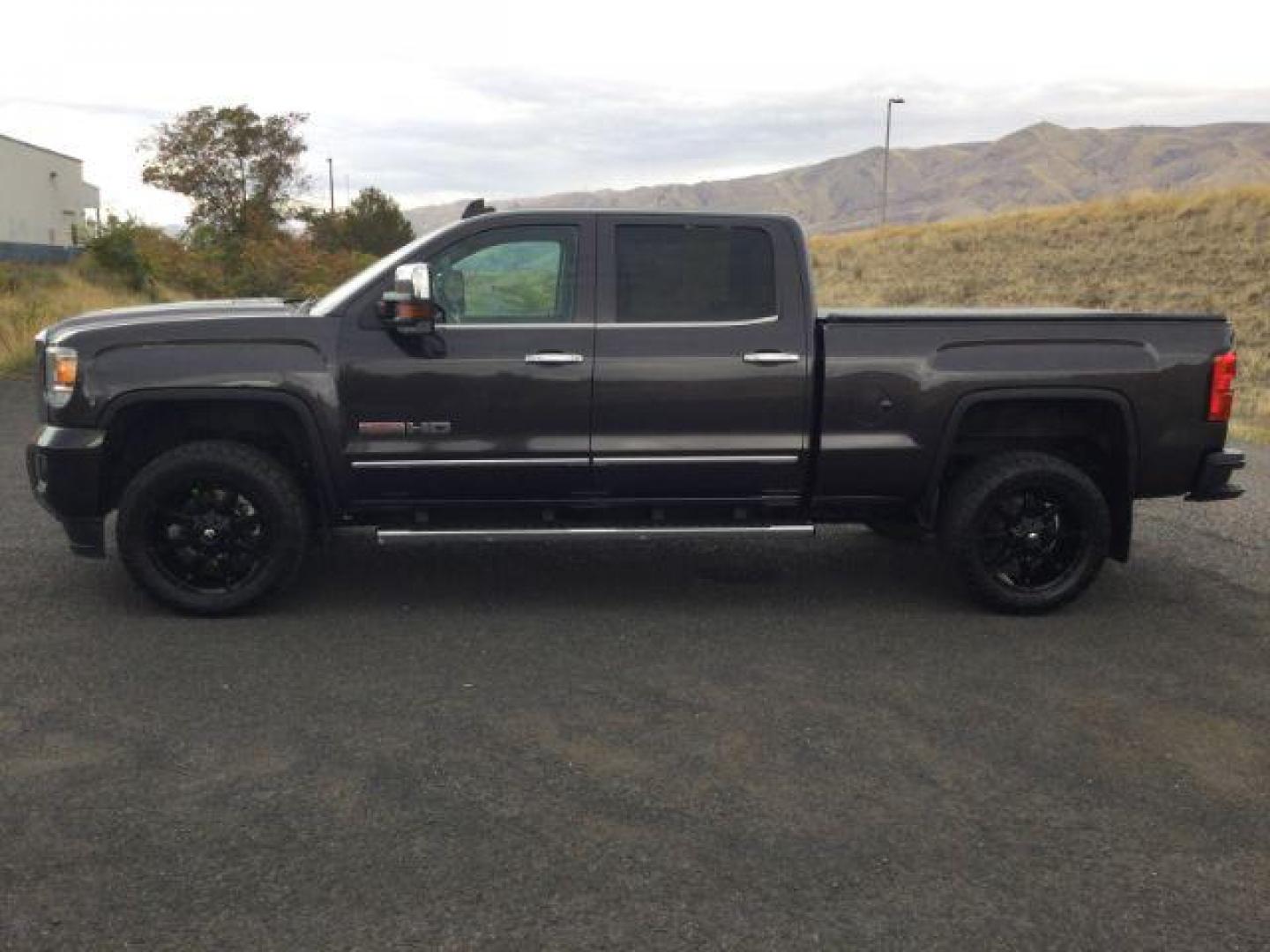 2015 Iridium Metallic /Dark Ash/Jet Black GMC Sierra 3500HD SLT (1GT423C85FF) with an 6.6L V8 OHV 32V TURBO DIESEL engine, 6-Speed Automatic transmission, located at 1801 Main Street, Lewiston, 83501, (208) 743-9371, 46.417065, -117.004799 - Photo#2