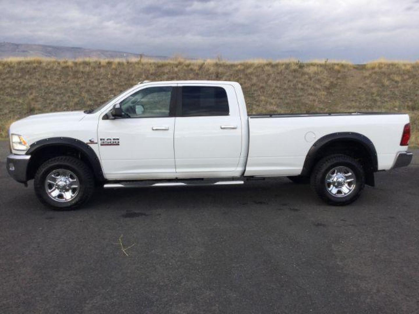 2013 Bright White Clearcoat /Diesel Gray/Black RAM 3500 SLT Crew Cab LWB 4WD (3C63R3HL8DG) with an 6.7L L6 OHV 24V TURBO DIESEL engine, 6-Speed Manual Transmission transmission, located at 1801 Main Street, Lewiston, 83501, (208) 743-9371, 46.417065, -117.004799 - Photo#1