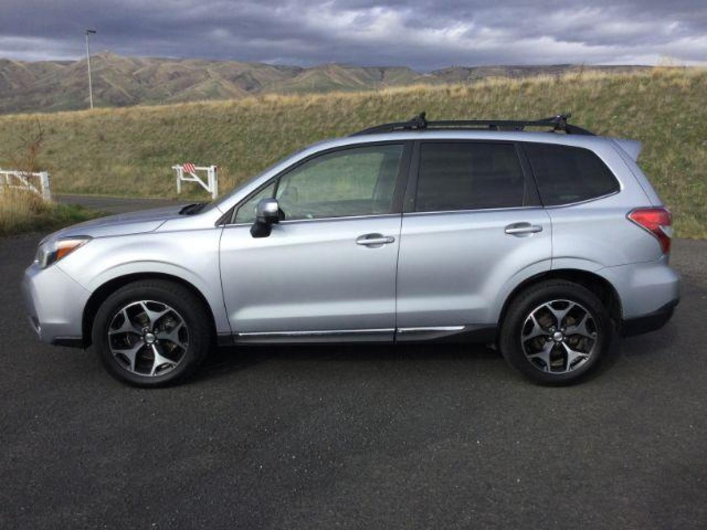 2015 Ice Silver Metallic /BLACK LEATHER Subaru Forester 2.0XT Touring (JF2SJGWC6FH) with an 2L H-4 gasoline direct injection engine, CVT Automatic transmission, located at 1801 Main Street, Lewiston, 83501, (208) 743-9371, 46.417065, -117.004799 - Photo#1