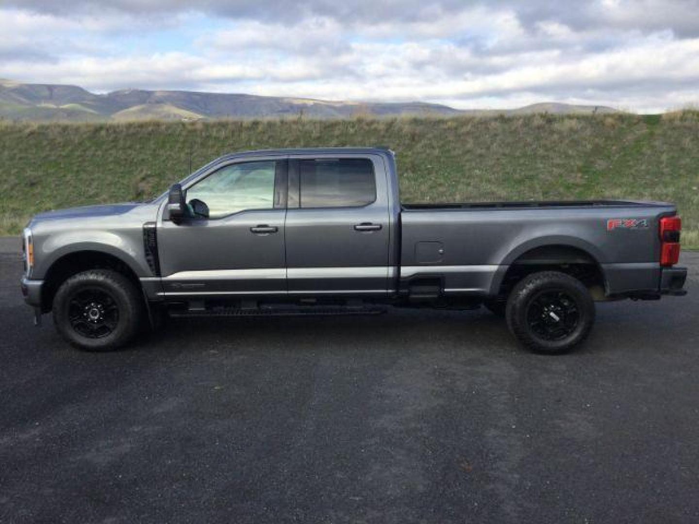 2023 Carbonized Gray Metallic /Medium Dark Slate Ford F-350 Crew Cab XLT Long Bed 4WD (1FT8W3BT4PE) with an Powerstroke 6.7L V-8 diesel direct injection engine, 10 speed automatic transmission, located at 1801 Main Street, Lewiston, 83501, (208) 743-9371, 46.417065, -117.004799 - Photo#3
