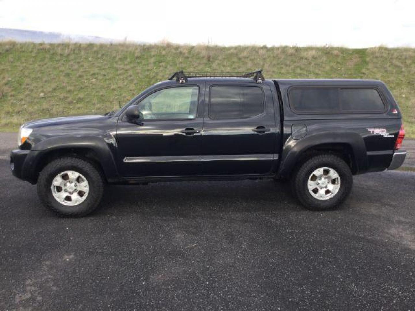 2006 Black Sand Pearl /Graphite Toyota Tacoma TRD Off Road Double Cab 4x4 (5TELU42N76Z) with an 4L V-6 DOHC engine, 6-Speed Manual Transmission transmission, located at 1801 Main Street, Lewiston, 83501, (208) 743-9371, 46.417065, -117.004799 - Photo#1