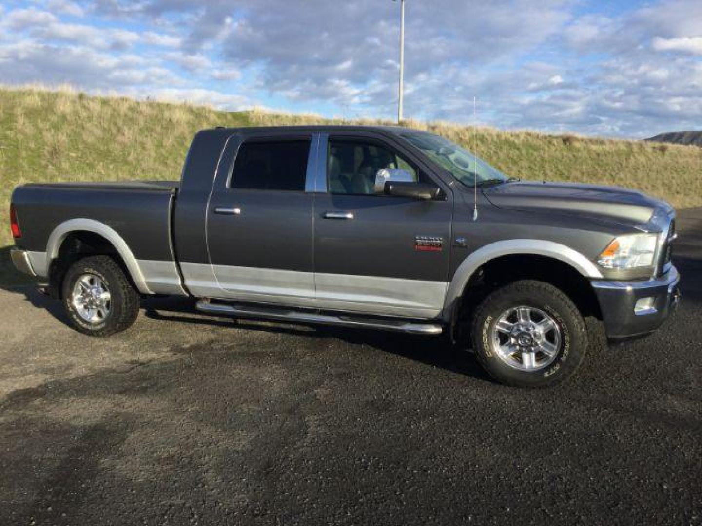2012 Mineral Gray Metallic Clearcoat /Black Leather Ram 2500 Laramie (3C6UD5NL1CG) with an Cummins 6.7L I-6 diesel direct injection engine, 6-Speed Automatic transmission, located at 1801 Main Street, Lewiston, 83501, (208) 743-9371, 46.417065, -117.004799 - Photo#0