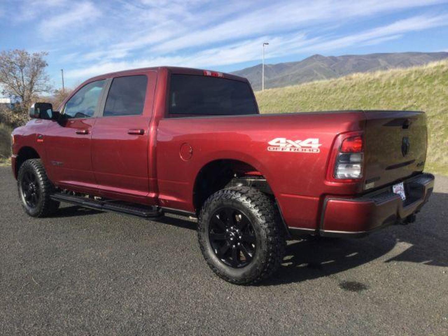 2021 Delmonico Red Pearlcoat /Black Ram 2500 Big Horn Crew Cab 4x4 6'4 Box (3C6UR5DL8MG) with an Cummins 6.7L I-6 diesel direct injection engine, 6-Speed Automatic transmission, located at 1801 Main Street, Lewiston, 83501, (208) 743-9371, 46.417065, -117.004799 - Photo#2