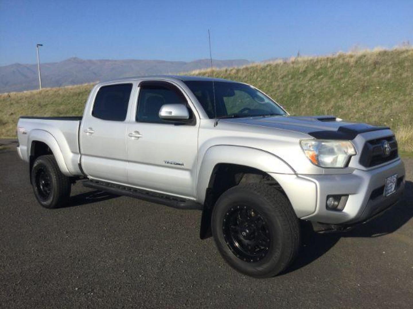 2012 Silver Streak Mica /Graphite Toyota Tacoma TRD Sport Crew Cab Long bed 4x4 (3TMMU4FN2CM) with an 4L V-6 DOHC engine, 5-Speed Automatic transmission, located at 1801 Main Street, Lewiston, 83501, (208) 743-9371, 46.417065, -117.004799 - Photo#0