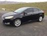 2016 Shadow Black /Charcoal Black Ford Focus Titanium (1FADP3J24GL) with an 2L I-4 gasoline direct injection engine, 6-Speed Automatic transmission, located at 1801 Main Street, Lewiston, 83501, (208) 743-9371, 46.417065, -117.004799 - Photo#18