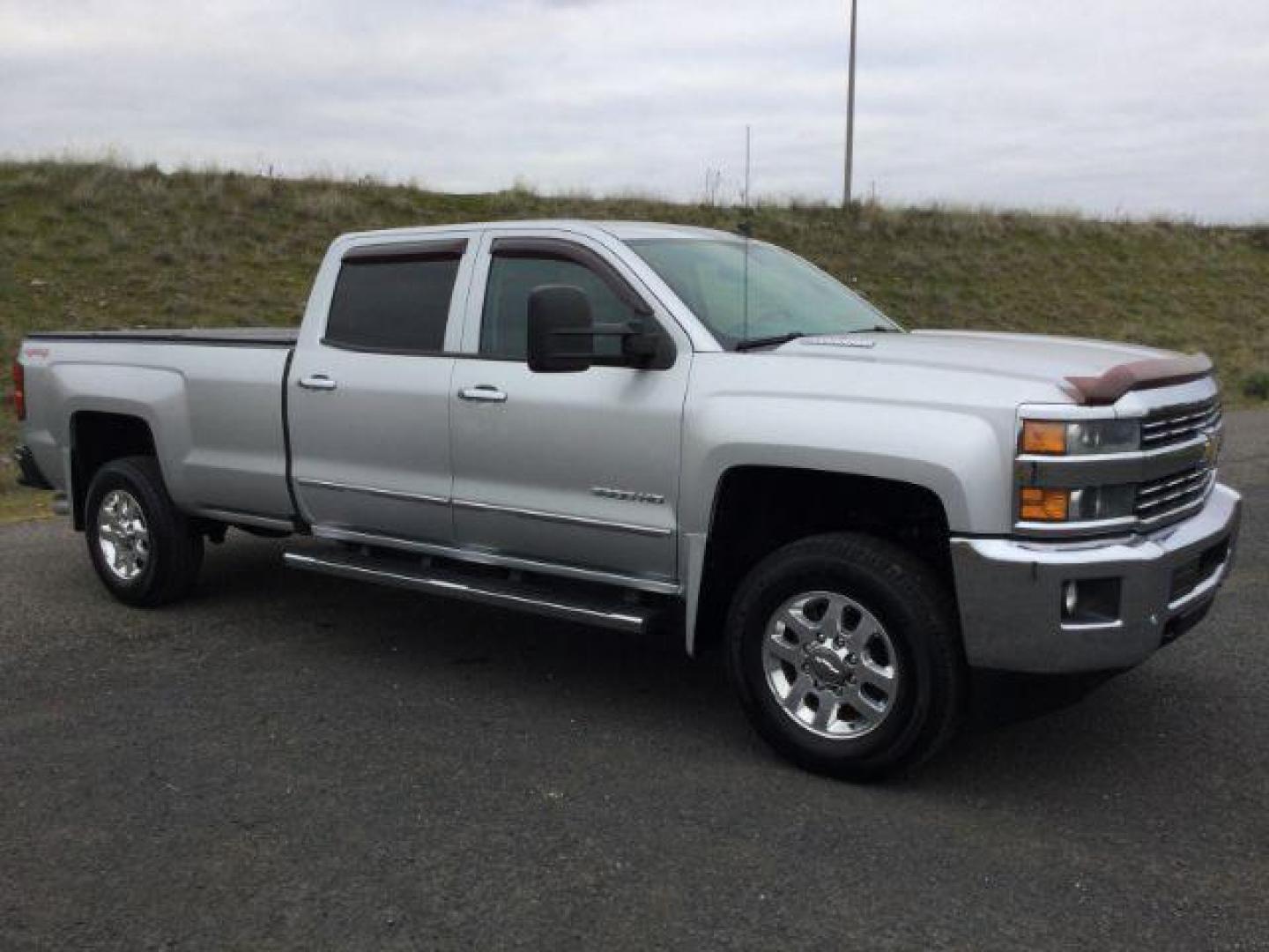 2015 Silver Ice Metallic /Jet Black Chevrolet Silverado 3500HD LTZ (1GC4K0C83FF) with an 6.6L V8 OHV 32V TURBO DIESEL engine, 6-Speed Automatic transmission, located at 1801 Main Street, Lewiston, 83501, (208) 743-9371, 46.417065, -117.004799 - Photo#10