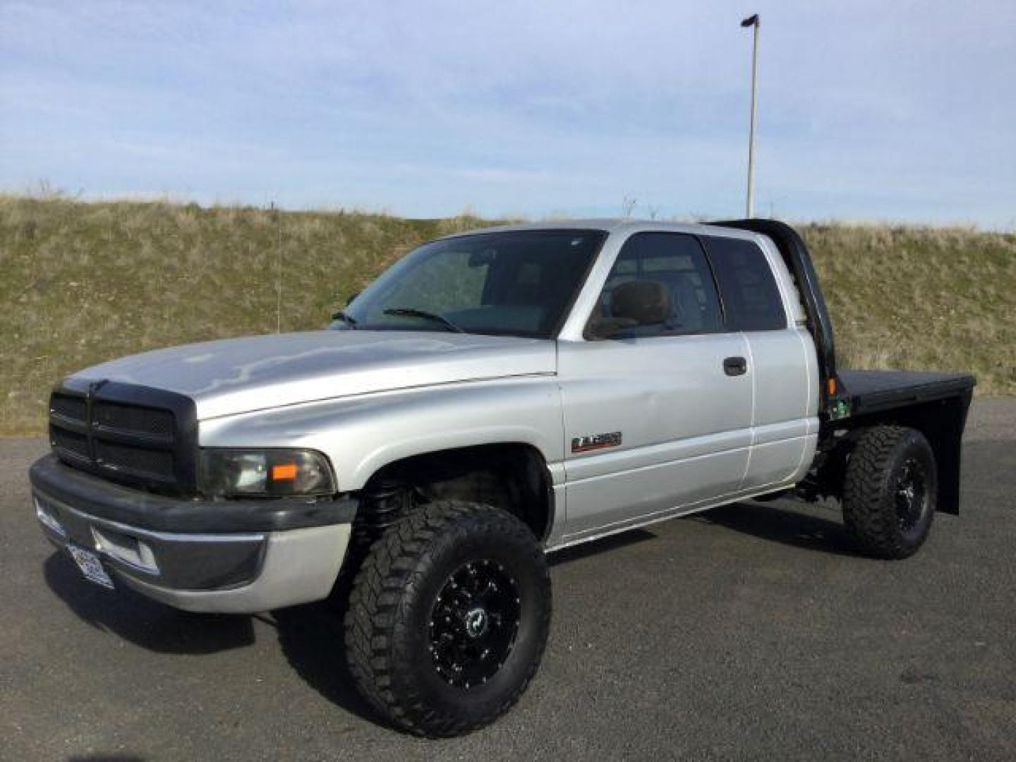 2002 Bright Silver Metallic Clearcoat /Agate Dodge Ram 2500 SLT | ST (3B7KF23CX2M) with an Cummins 5.9L I-6 diesel direct injection engine, 6-SPEED transmission, located at 1801 Main Street, Lewiston, 83501, (208) 743-9371, 46.417065, -117.004799 - Photo#0