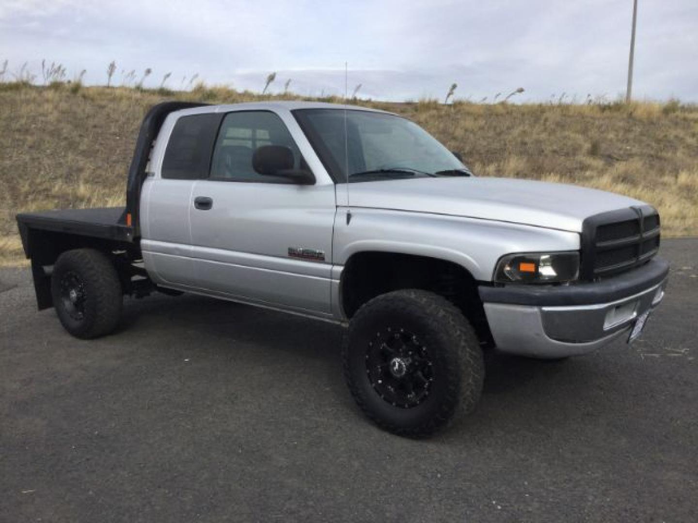 2002 Bright Silver Metallic Clearcoat /Agate Dodge Ram 2500 SLT (3B7KF23CX2M) with an Cummins 5.9L I-6 diesel direct injection engine, 6-Speed Manual Transmission transmission, located at 1801 Main Street, Lewiston, 83501, (208) 743-9371, 46.417065, -117.004799- Photo#0