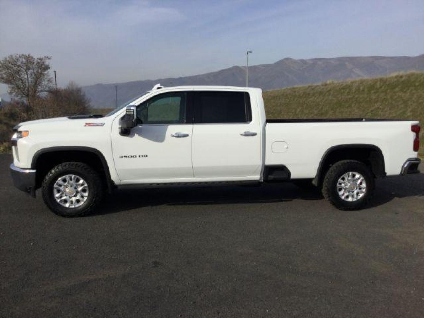 2023 Summit White /Jet Black Chevrolet Silverado 3500HD Crew Cab LTZ Long Bed 4x4 (1GC4YUEY1PF) with an Duramax 6.6L V-8 diesel direct injection engine, 10-speed automatic transmission, located at 1801 Main Street, Lewiston, 83501, (208) 743-9371, 46.417065, -117.004799 - Photo#2